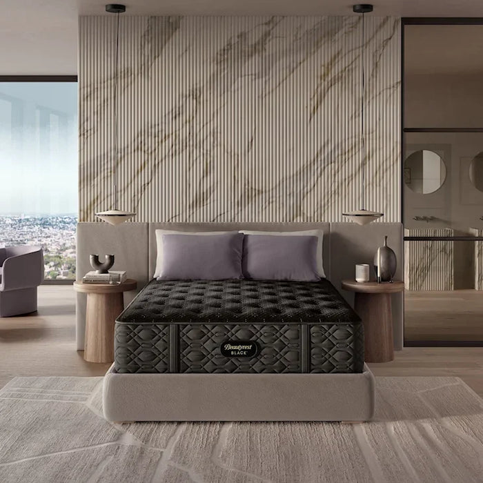Black mattress on a bed in a modern bedroom with marble wall and city view.