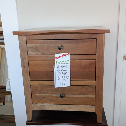 Wooden nightstand with a Superstore clearance sign on a white wall.