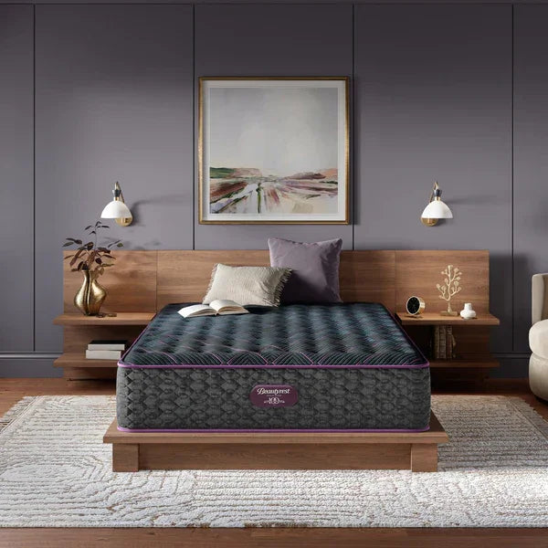Mattress on a wooden bed frame in a bedroom setting with decor elements.